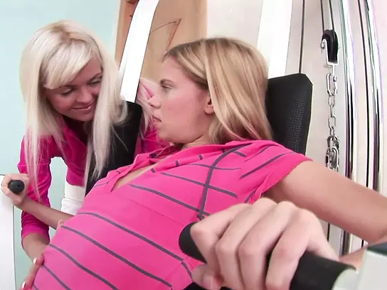 Watch these young babes strip down and pleasure each other with big dildos